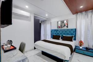 En eller flere senge i et værelse på Townhouse Passport Office Saligramam Formerly K.K Nagar Residency + 28 billeder