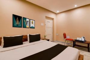 Postel nebo postele na pokoji v ubytování Super Collection O Puri Seaview Formerly Hotel Aavaas