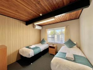 Postel nebo postele na pokoji v ubytování Mountain View Motel