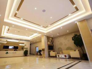an office lobby with a coffered ceiling and a reception desk at GreenTree Inn Xuancheng Jingxian Wannan First Street Express Hotel in Jingxian