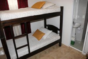 Postel nebo postele na pokoji v ubytování Hotel Abadia