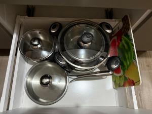 a bunch of pots and pans sitting on top of a sink at Panoramic View apartment Seraidi Annaba in Annaba