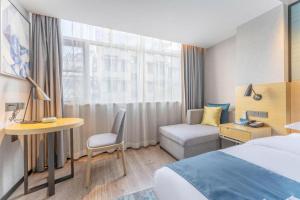 Postel nebo postele na pokoji v ubytování Echarm Hotel Fuzhou Sanfang Qixiang East Street Metro Station + 239 fotografií