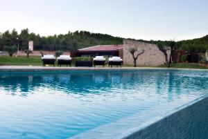 Bazén v ubytovaní Hotel El Molí alebo v jeho blízkosti
