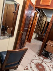 a hallway with wooden doors and a rug at Departamento Nuevo Céntrico Las Marías 2 in Saltillo