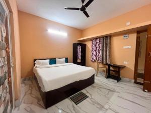 Postel nebo postele na pokoji v ubytování Hotel O Sunrise