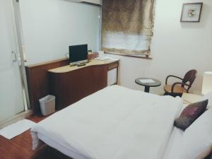 TV a/nebo společenská místnost v ubytování 玉泉旅館 + 26 fotografií