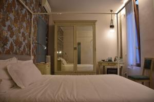 Postel nebo postele na pokoji v ubytování Ca' Monteggia Guest House