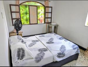 Ένα ή περισσότερα κρεβάτια σε δωμάτιο στο Central Point Air BAQ