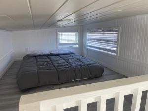 Postel nebo postele na pokoji v ubytování CampTinyHomes