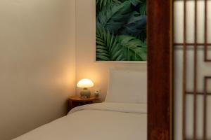 Una cama o camas en una habitación de Exclusive House Hanok Stay 'Soo Hanok'