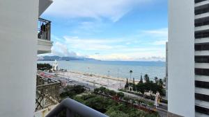 a view of the ocean from a balcony of a building at LE SOLEIL HOTEL managed by NEST Group in Nha Trang