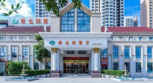 a building with an entrance in front at Vienna Hotel Tianjin Zhongbei Town in Tianjin