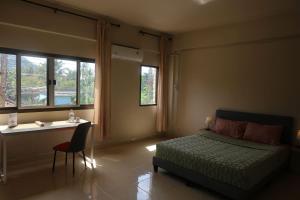 Ένα ή περισσότερα κρεβάτια σε δωμάτιο στο COWORX Koh Lanta +60 φωτογραφίες