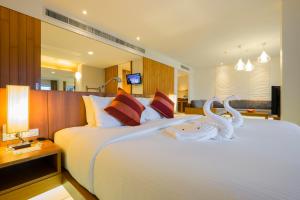 Postel nebo postele na pokoji v ubytování G Hua Hin Resort & Mall
