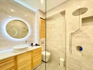 a bathroom with a sink and a shower at Lux Garden Appartments in Kharkiv +10 photos