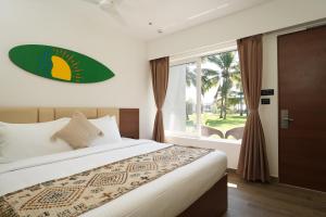 En eller flere senge i et værelse på Trishvam Palolem Beach Resort