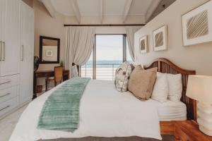 En eller flere senge i et værelse på Klippies - Seafront