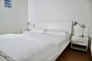 Voodi või voodid majutusasutuse Windshouse Apartments toas