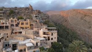 a group of houses on top of a mountain at Bait Falaj Al Misfah Hospitality in Misfāh