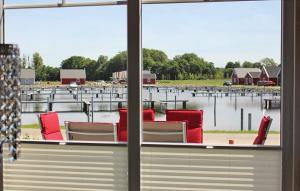 a view of a marina from a window at Haus Hafenidyll in Wandlitz