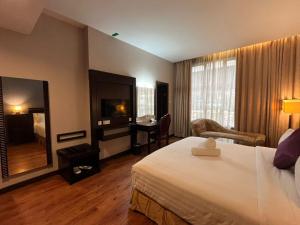 Postel nebo postele na pokoji v ubytování Kingston Hotel 18 - Kuala Lumpur Sri Damansara + 29 fotografií