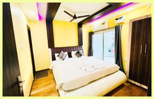 En eller flere senge i et værelse på The Drimea Hapur UP