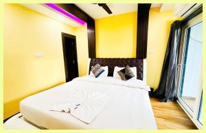 En eller flere senge i et værelse på The Drimea Hapur UP