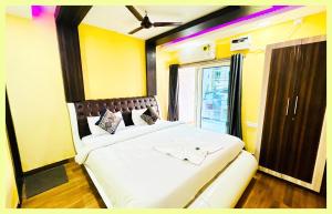 En eller flere senge i et værelse på The Drimea Hapur UP