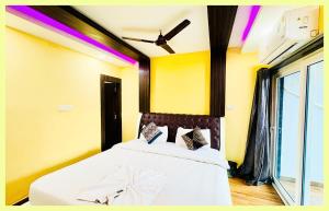 En eller flere senge i et værelse på The Drimea Hapur UP