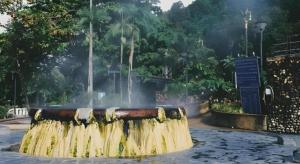 a fountain with water coming out of it in a park at Rommai Rimnaam Resort in Ban Bang Rin (1)