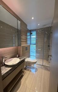 Koupelna v ubytování GTC Apartment Hotel