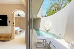 an internal view of a house with a glass floor at Centara Karon Villas Phuket in Karon Beach