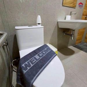 a bathroom with a white toilet and a sink at Aqua pool villa in Ban Nong Thale +40 photos