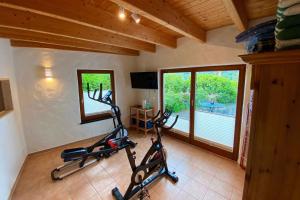 a gym with two exercise bikes in a room at Ferienhaus Rothaarblick in Schmallenberg