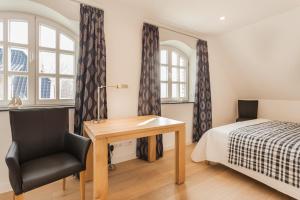 En eller flere senge i et værelse på Haus Hafenflair