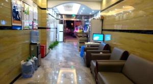 Una televisión o centro de entretenimiento en Shell Jiaxing Nanhu District Dongsheng Dong Road Moon River Street Hotel 26 fotos más