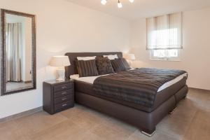 En eller flere senge i et værelse på Haus Meeresrauschen