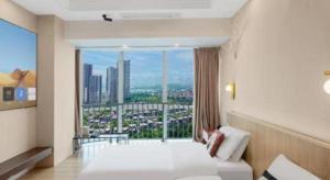 Postel nebo postele na pokoji v ubytování Mandolin Intelligent Hotel Jinagmen + 281 fotografií