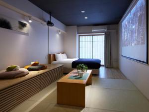 Ένα ή περισσότερα κρεβάτια σε δωμάτιο στο Minn Shin-Osaka