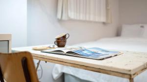 Una cama o camas en una habitación de Gyeongju Hwangnaminn Pension 2 fotos más