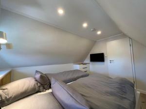 Giường trong phòng chung tại Dünen Lodge 6