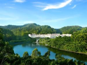 a view of a river with a building in the distance at Dongguan MCB Lake Hotel in Dongguan