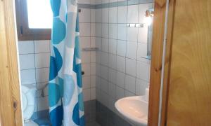 a bathroom with a sink and a toilet and a shower at guest house kalamaki beach preveza in Rizá