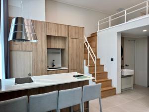 a kitchen with a table and chairs and a staircase at Namsan Dream City in Seoul
