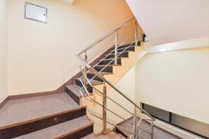 a set of stairs in a building at FabHotel The Grand Manmuralidhar - Hawa mahal 3 km, Chandpol metro station in Jaipur