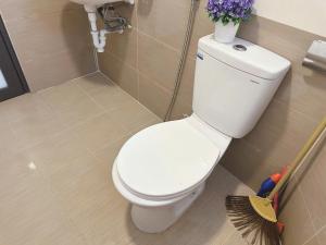 a bathroom with a white toilet and a sink at Phương Đông 502DT in Hanoi +28 photos