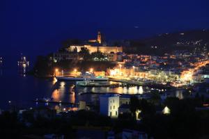 a city lit up at night with a harbor at Hotel Villa Enrica - Aeolian Charme in Lipari