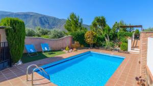 Bazén v ubytování Cortijo El Olivar Órgiva by Ruralidays nebo v jeho okolí