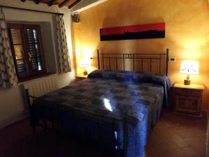 Voodi või voodid majutusasutuse Dimora nel Chianti toas
